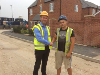 jordan-goulding-shaking-hands-with-dan-davies-regional-audit-manager-for-matthews-leigh