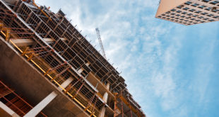 Building construction site with scaffolding