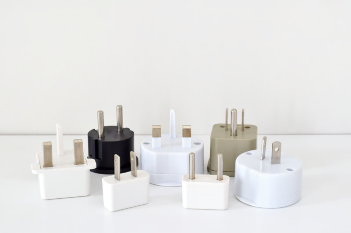 Travel Adaptors Safety Warning for UK Travellers Travel Adaptors being checked for electrical safety before a holiday