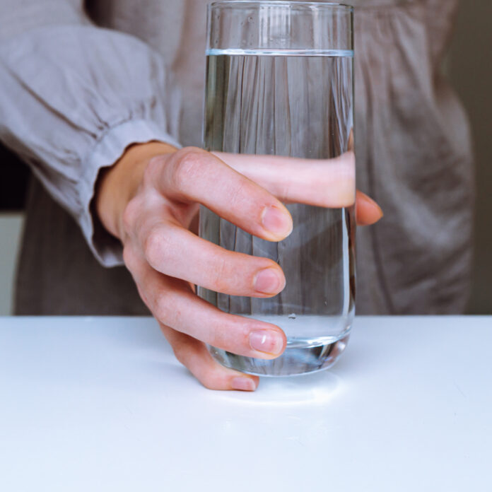 Clean drinking water from a home water filter Glass of clean drinking water from a home water filter