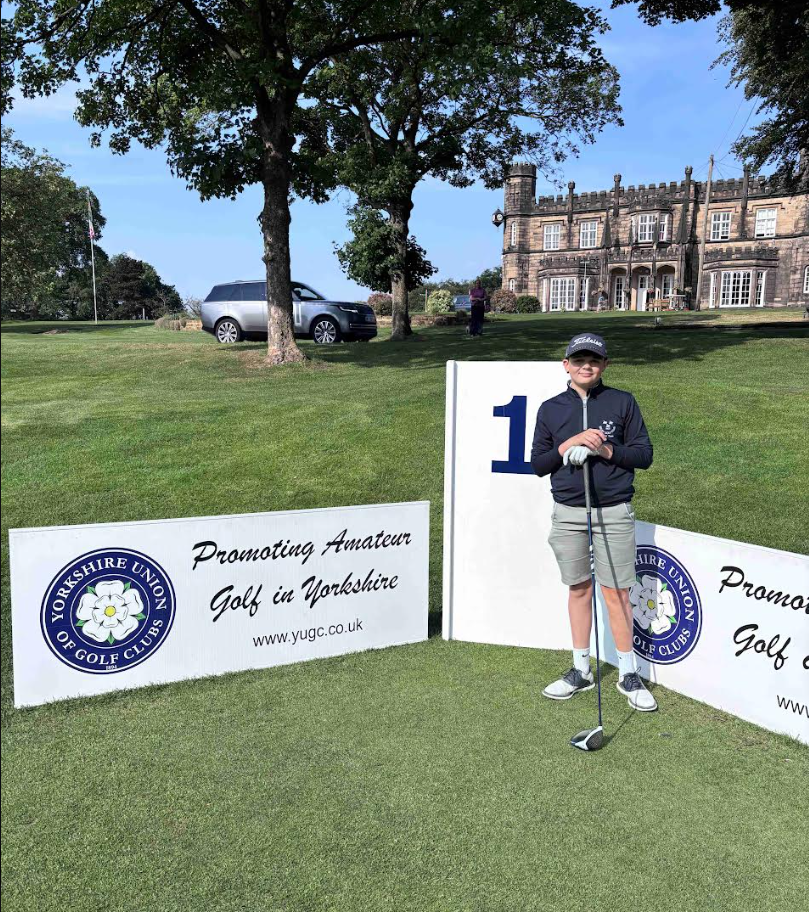 Lucas Skilbeck holding a golf club