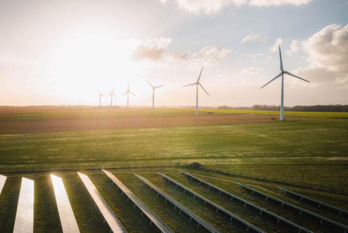 Solar and wind renewable energy projects Natural Power renewable energy site with solar panels and wind turbines